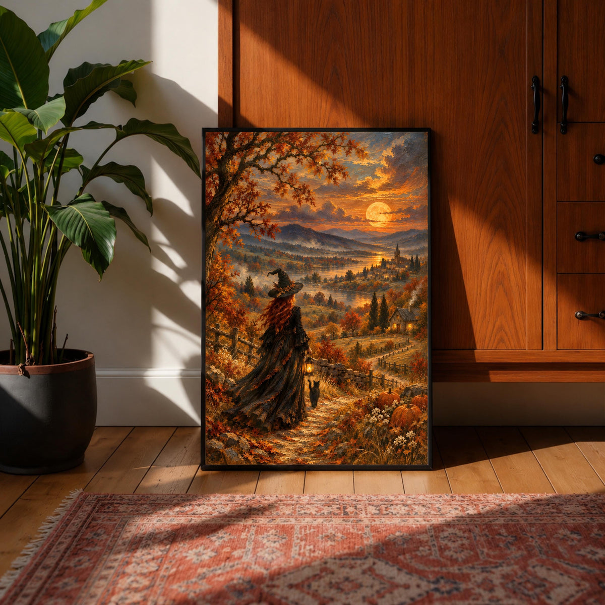 Gothic cottagecore wall art displayed above a mustard-yellow sofa against a dark green accent wall. The artwork features a red-haired witch in a flowing black dress overlooking a moonlit autumn valley.