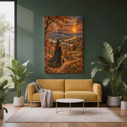 Mystical autumn witch wall art displayed above a mustard-yellow sofa against a dark forest green accent wall. The vintage-inspired landscape painting features a red-haired witch in a flowing black gown walking with her black cat and glowing lantern beneath a golden harvest moon. Large leafy houseplants and neutral furnishings complement the warm orange fall scenery.