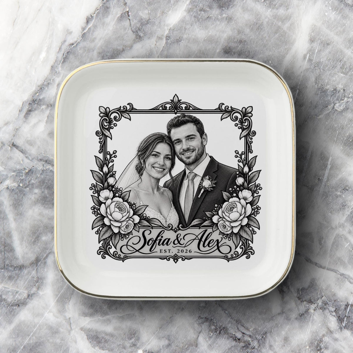 Custom bride and groom keepsake dish shown on a soft neutral fabric background with a black-and-white portrait, floral frame, names, and wedding year.