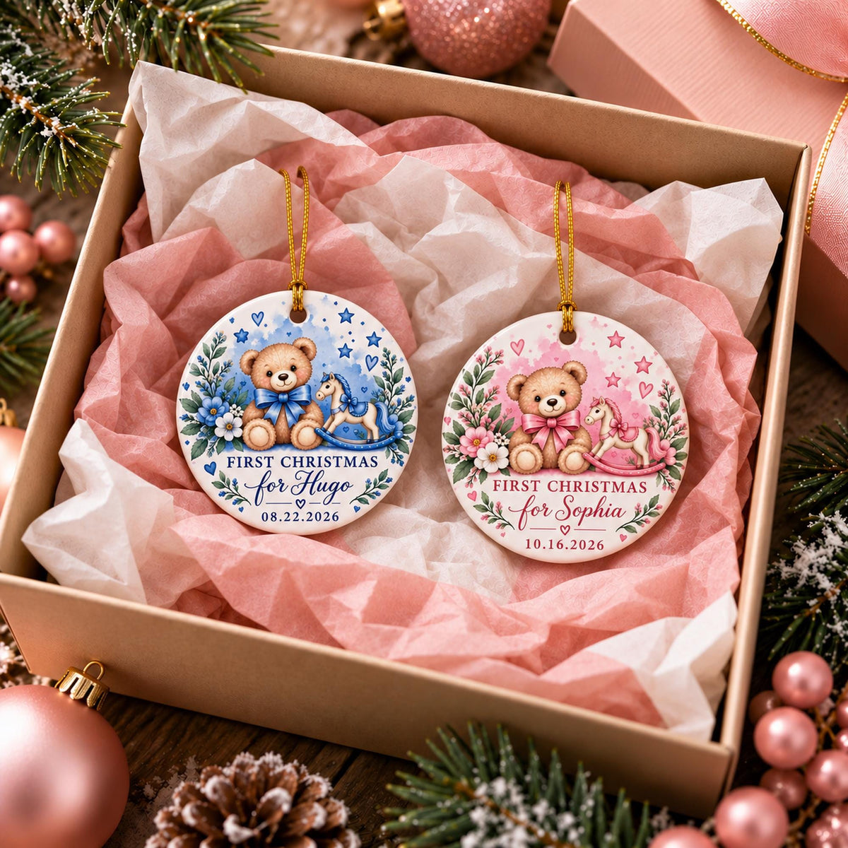 Pink and blue personalized baby ornaments displayed together in a gift box with satin ribbon, featuring custom names, dates, teddy bears, and rocking horses.