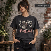 Graphite Comfort Colors tee featuring the distressed “I Identify as the Problem” artwork on a dark charcoal-style shirt.