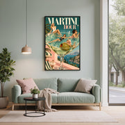 Colourful mid-century cocktail print displayed above a sage green sofa in a bright living room. The design features four stylish women, sparkling teal water, coastal villas, and Mediterranean summer scenery.