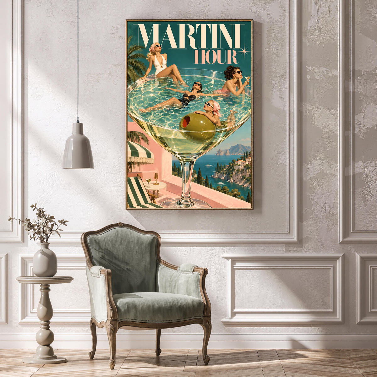 Retro Martini Hour wall art displayed in an ornate white room with decorative wall moulding and a vintage green armchair. The colourful poster features glamorous women, an oversized olive cocktail, and a scenic Italian coastline.