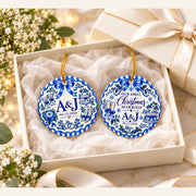 Classic Wedding and First Christmas Married ceramic ornaments arranged in a cream gift box with tissue paper and satin ribbon, featuring custom initials and wedding dates.