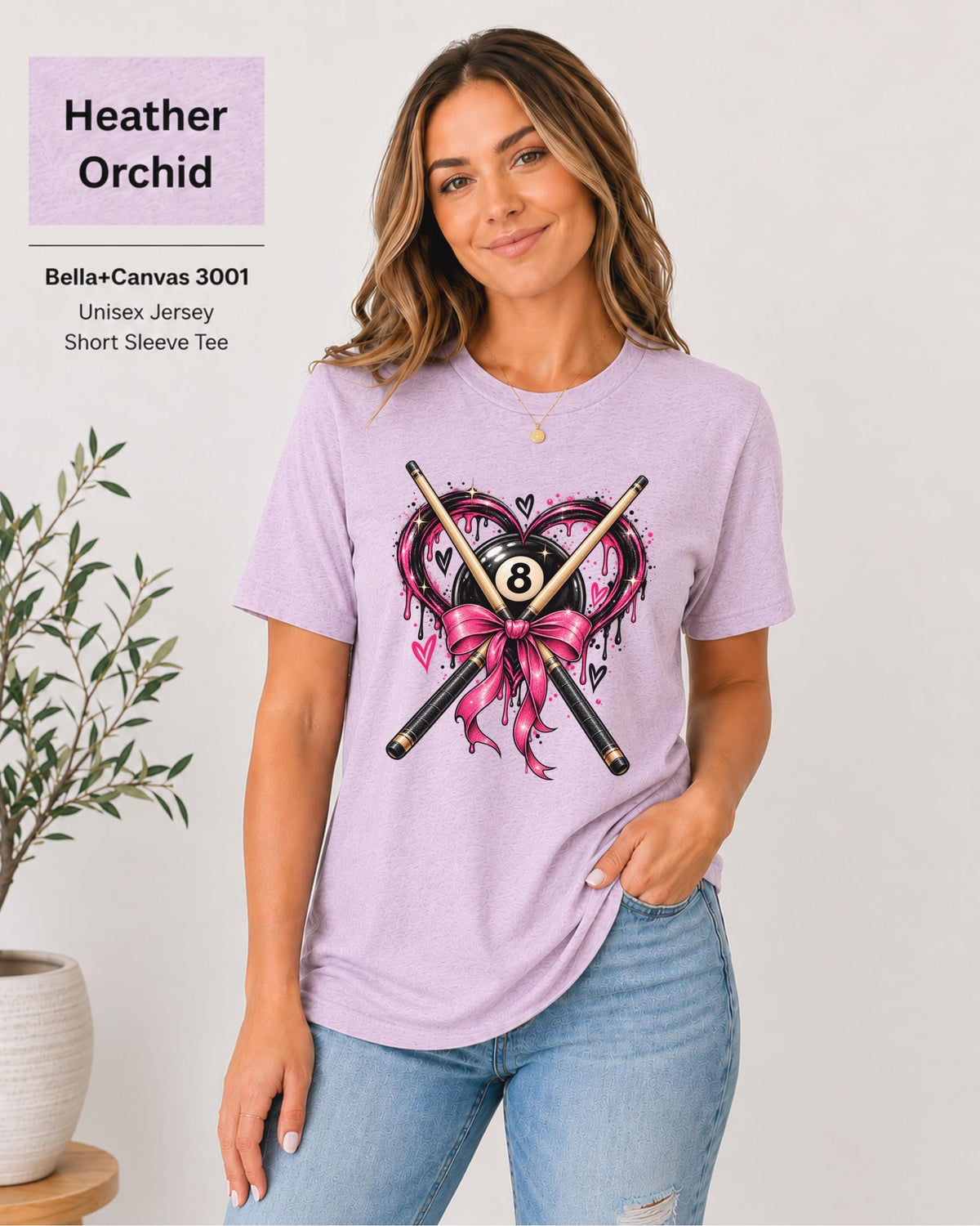 Orchid Bella+Canvas tee displaying the colorful billiards graphic with pink bow, heart, pool cues, and black 8 ball.