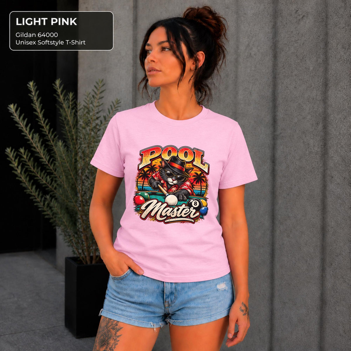 Light Pink Gildan 64000 T-shirt showing the playful Pool Master cat artwork with bright retro colors and billiards theme.