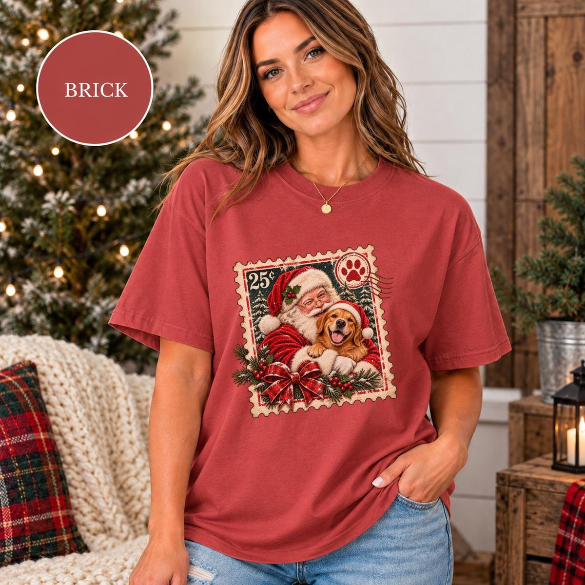 Brick Comfort Colors shirt featuring the personalized Santa dog design with red plaid ribbon, holly accents, snowy background, and vintage holiday styling.
