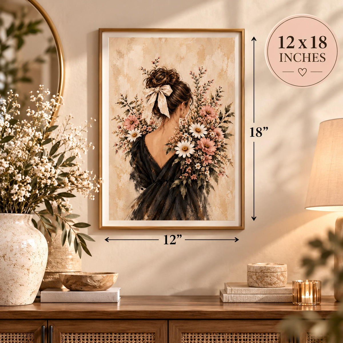 12 x 18 inch floral woman poster shown in a natural wood frame in a cozy, minimalist room. The vintage-inspired artwork features a brunette woman with a cream hair bow, flowing charcoal dress, pink wildflowers, and delicate white blossoms against a warm neutral background.