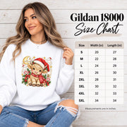 Gildan 18000 size chart mockup showing sweatshirt measurements, fit information, and the Highland cow Christmas graphic on a white crewneck.