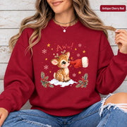 Antique Cherry Red Gildan sweatshirt featuring the baby reindeer holiday design with snowy accents, stars, greenery, and playful winter details.