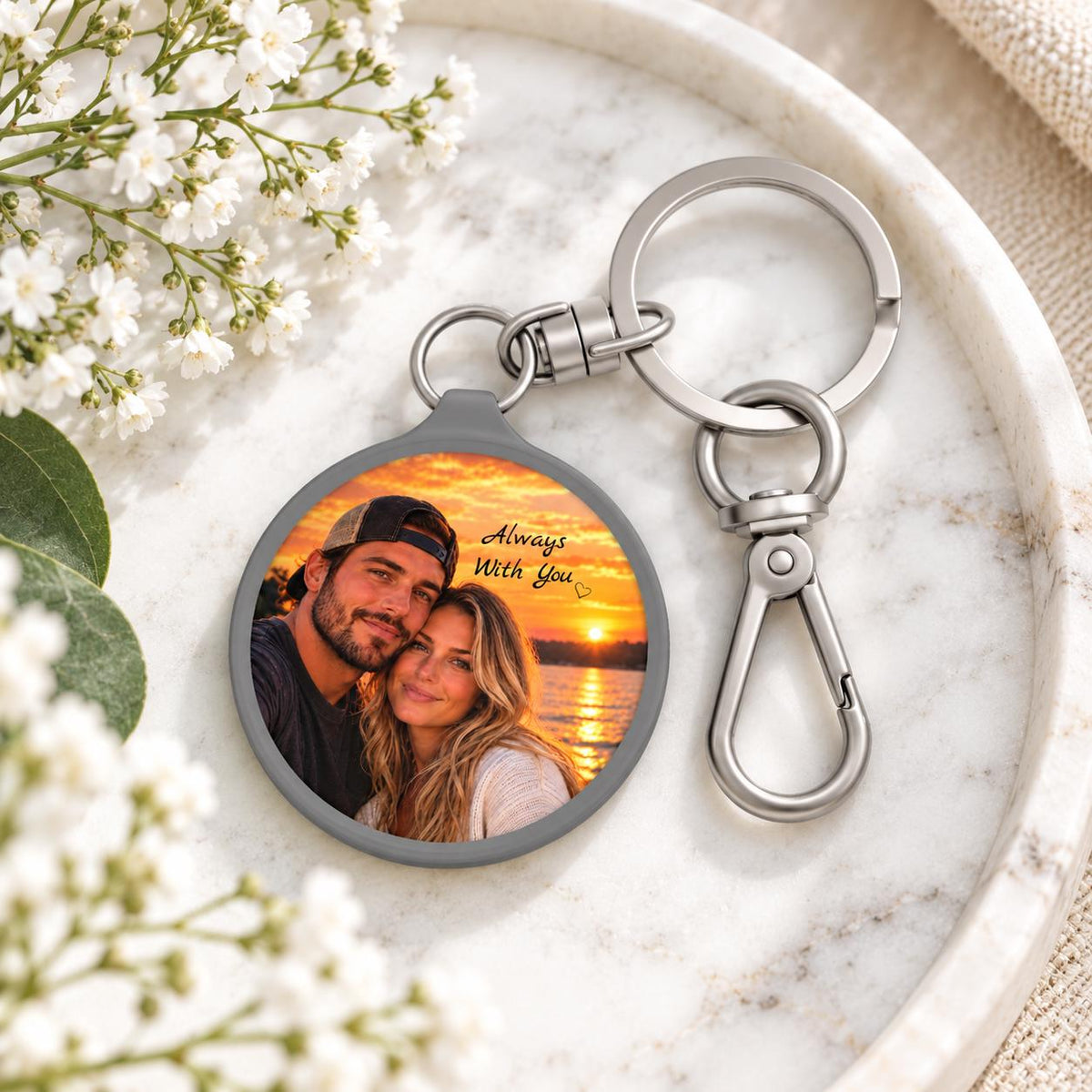 Personalized photo keychain styled with delicate flowers and soft neutral decor, featuring a couple portrait at sunset.
