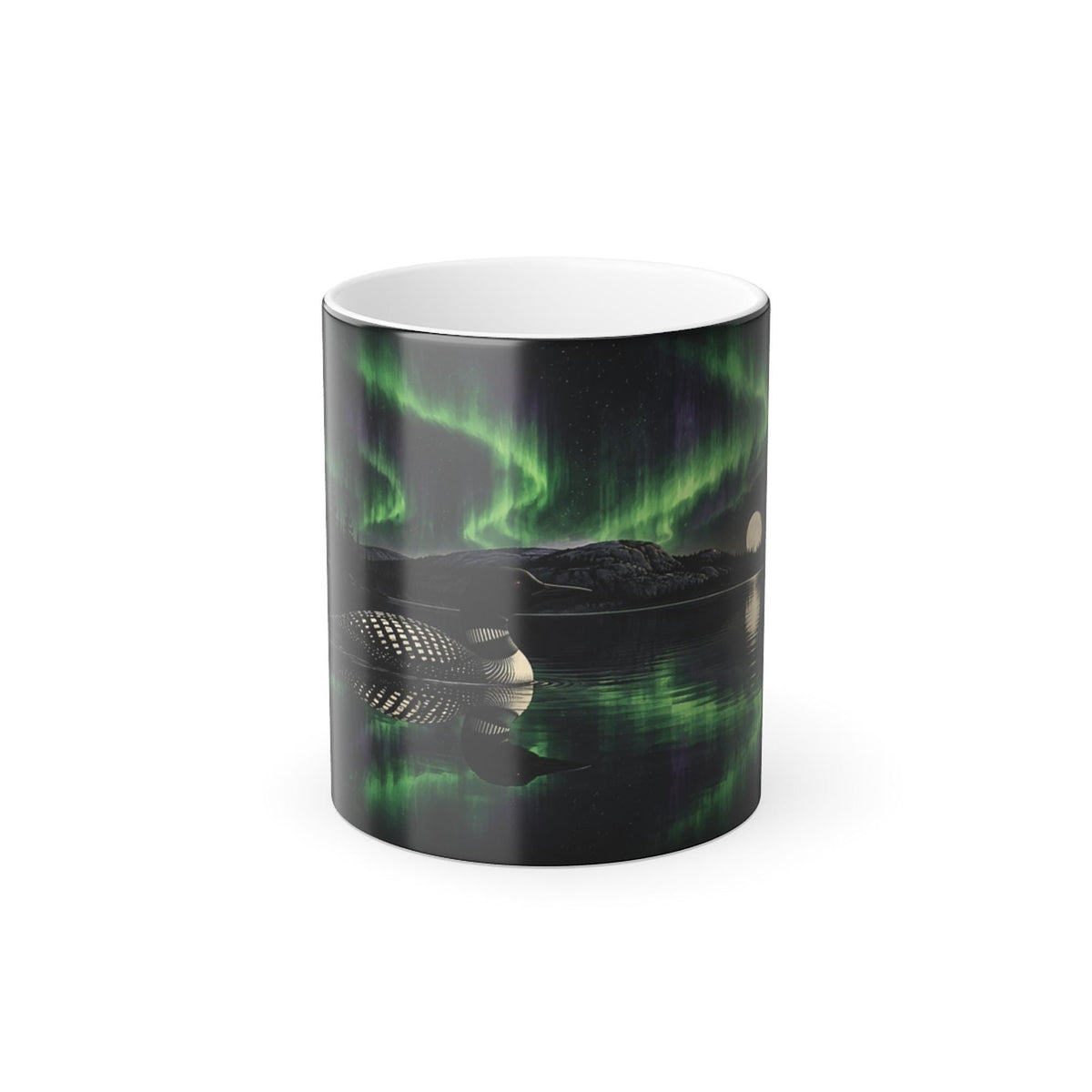 Printify product mockup of the 11 oz black colour-changing mug printed with a loon on a still lake reflecting green northern lights and a full moon